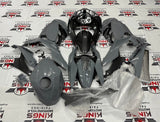 Fairing kit for a Kawasaki Ninja 400 (2018-2023) Dark Nardo Gray & Faux Carbon Fiber at KingsMotorcycleFairings.com